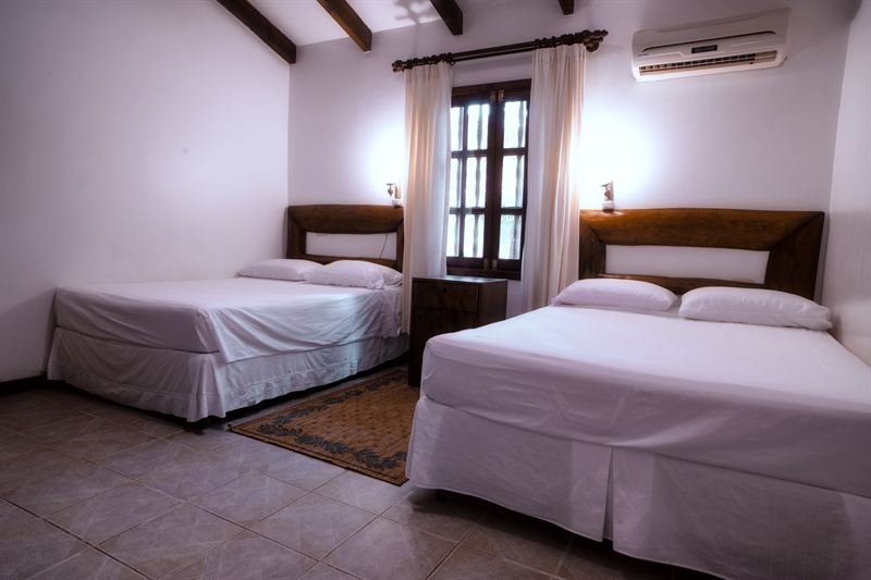 Segunda habitación con dos camas de la Cabaña Deluxe Familiar